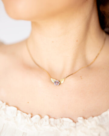 Lady-neckline-wearing-a-dainty-gold-plated-snake-chain-choker-necklace with-pastel-porcelain rose-and-tiny-gold-leaves.